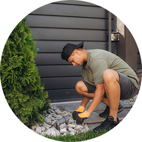 Man gardening outside a home